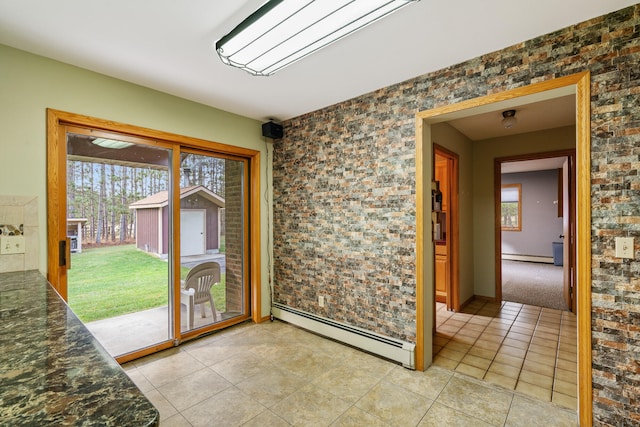 entryway featuring light tile patterned flooring and a baseboard radiator