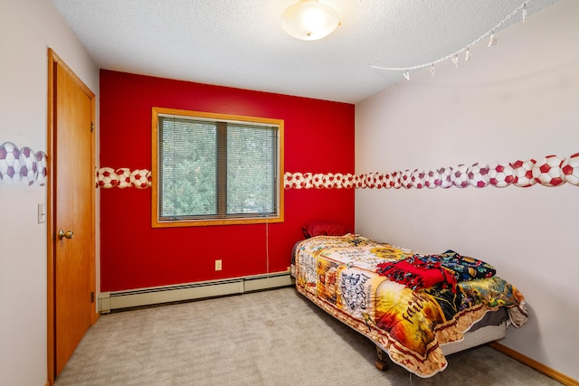 bedroom with light carpet, a baseboard radiator, and a textured ceiling