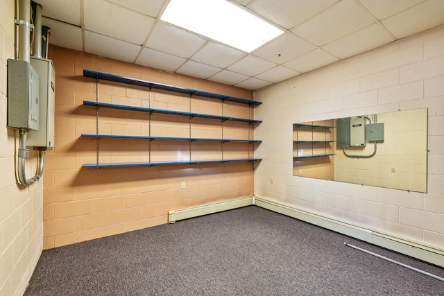 basement with carpet flooring and a paneled ceiling