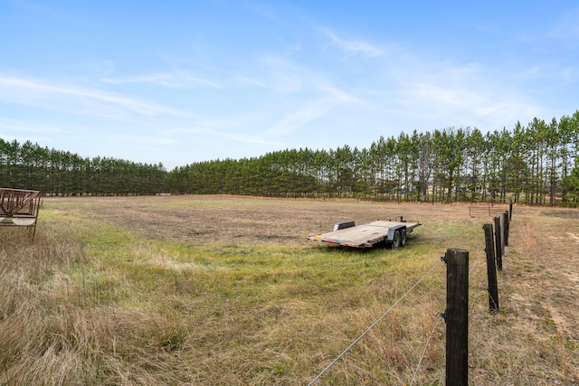 view of yard with a rural view