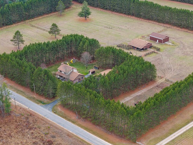 birds eye view of property with a rural view