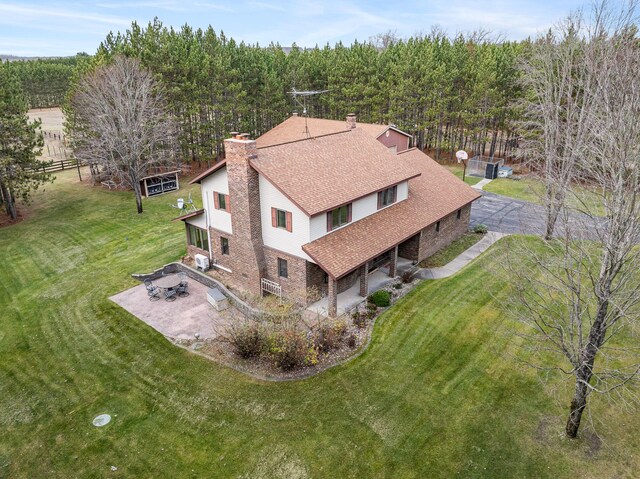 birds eye view of property with a rural view