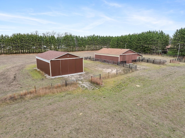 view of yard featuring an outbuilding and a rural view