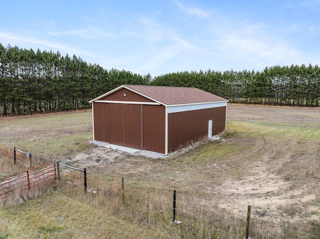 view of outbuilding with a rural view