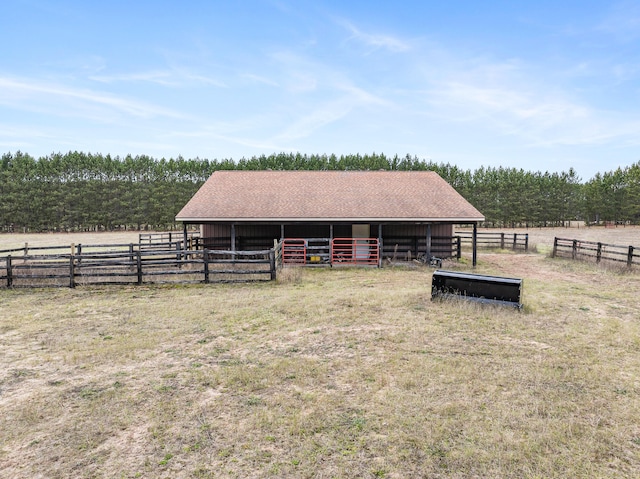 view of stable featuring a rural view