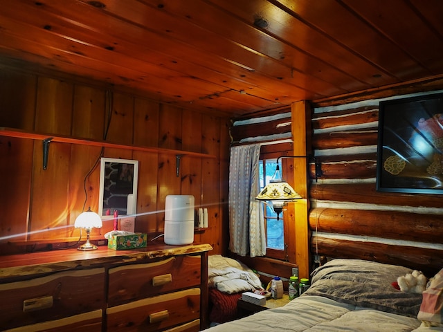 bedroom featuring wooden walls and wooden ceiling