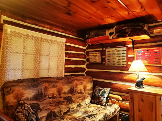 interior space with log walls and wooden ceiling