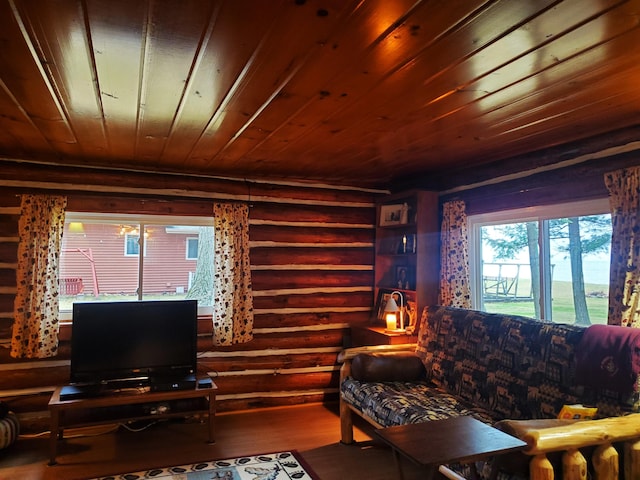 living room with hardwood / wood-style floors, wood ceiling, and rustic walls