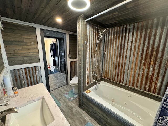 full bathroom featuring hardwood / wood-style flooring, vanity, shower / bathtub combination, and toilet