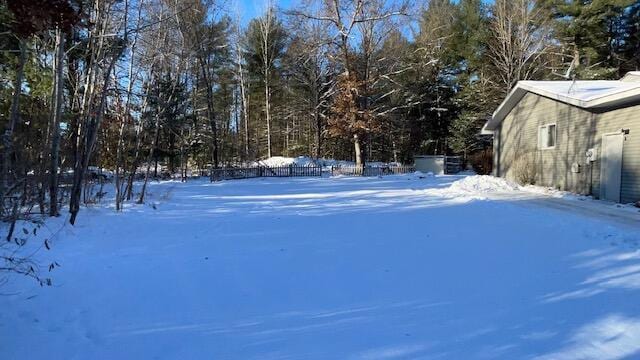 view of yard covered in snow