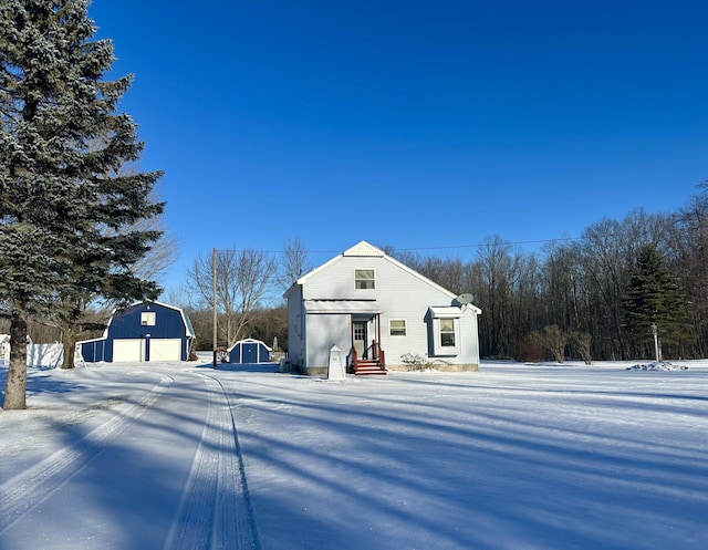 exterior space featuring a garage and an outdoor structure