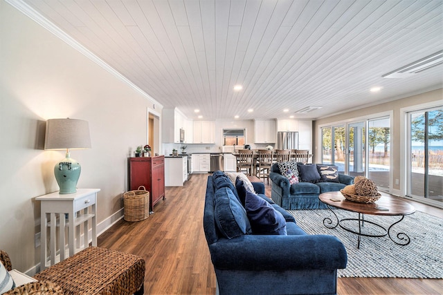 living room featuring dark wood-type flooring, wood ceiling, and crown molding