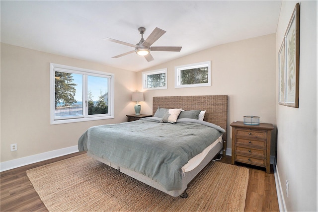 bedroom with hardwood / wood-style flooring, ceiling fan, and lofted ceiling