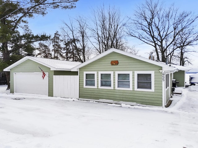 view of front facade with a garage and an outdoor structure