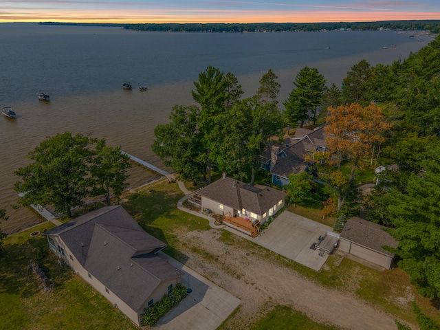 aerial view at dusk with a water view