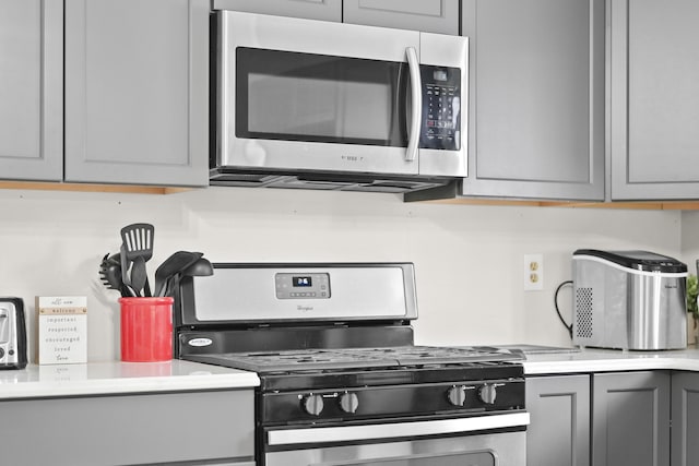 kitchen featuring gray cabinetry and stainless steel appliances