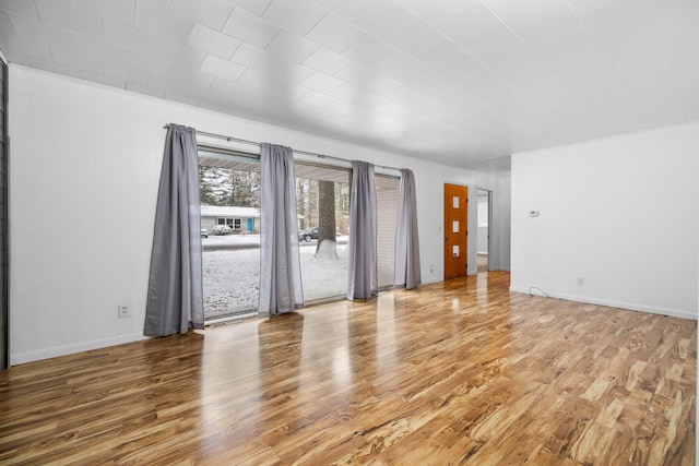 empty room featuring hardwood / wood-style flooring