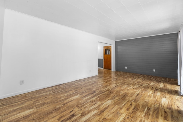 spare room with dark wood-type flooring