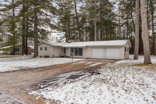 ranch-style house featuring a garage