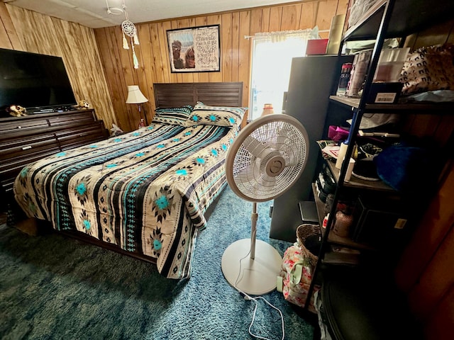 carpeted bedroom with wooden walls