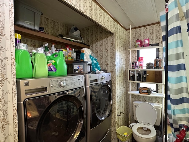 laundry area featuring independent washer and dryer and a textured ceiling