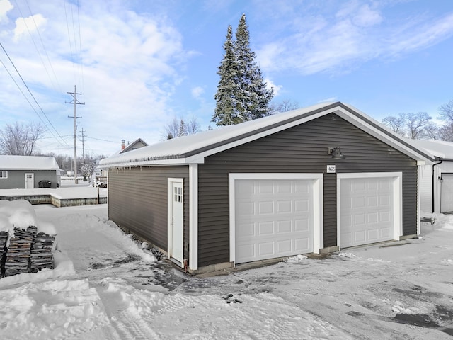 view of snow covered garage