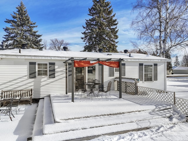 view of snow covered house