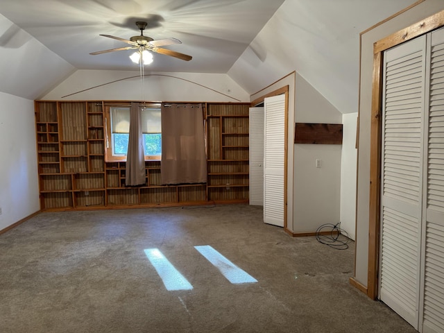 additional living space featuring ceiling fan, carpet, and lofted ceiling