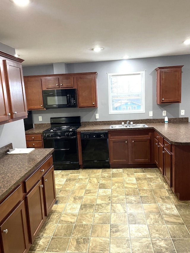 kitchen with black appliances and sink