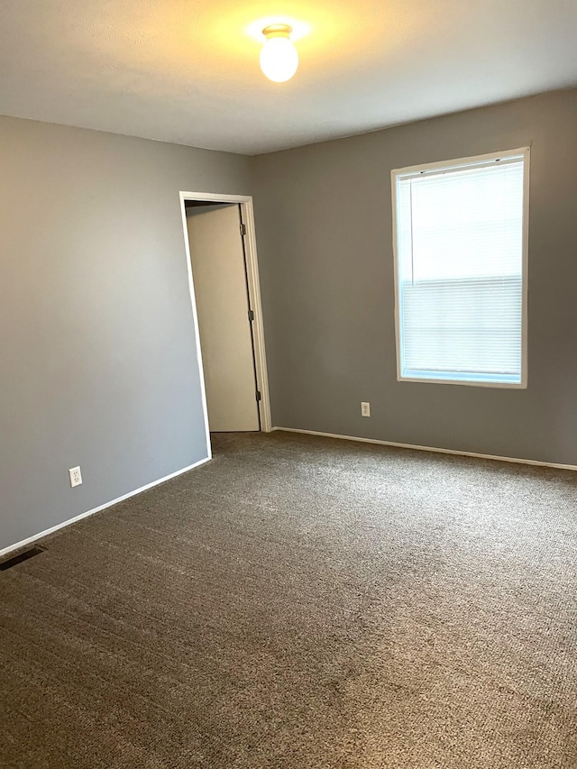 view of carpeted spare room