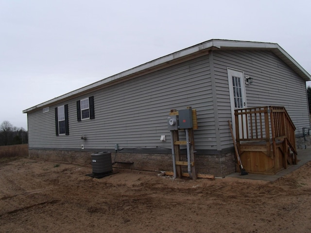 view of property exterior with central AC unit