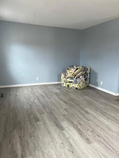 empty room featuring hardwood / wood-style floors