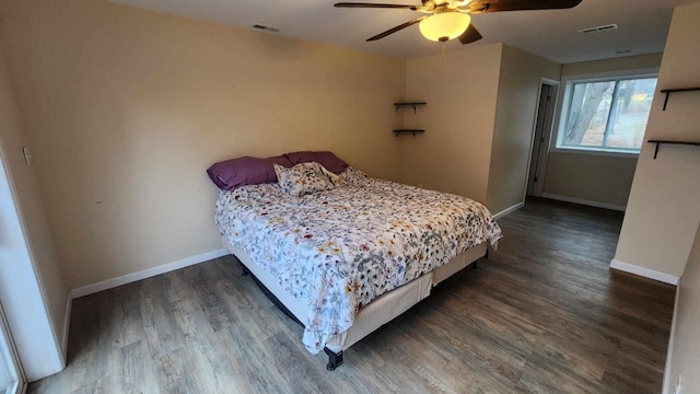 bedroom with ceiling fan and dark hardwood / wood-style floors