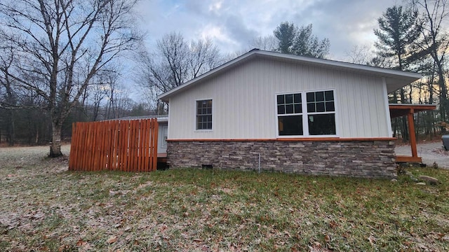 view of home's exterior with a yard