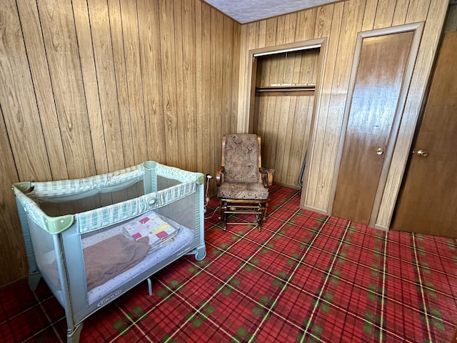 bedroom with wooden walls