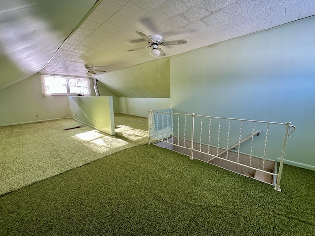 additional living space featuring carpet, ceiling fan, and lofted ceiling