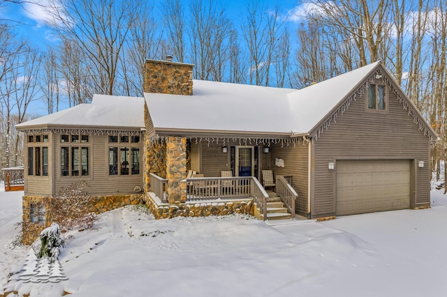 view of front of home with a porch and a garage