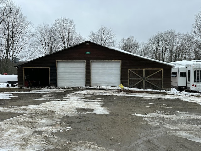 view of snow covered garage