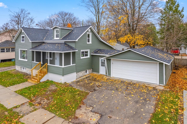 view of front of home with covered porch and a garage