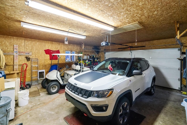 garage featuring a garage door opener