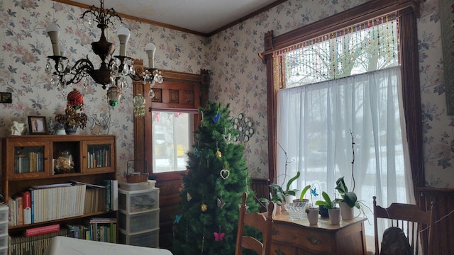 dining space featuring an inviting chandelier and ornamental molding