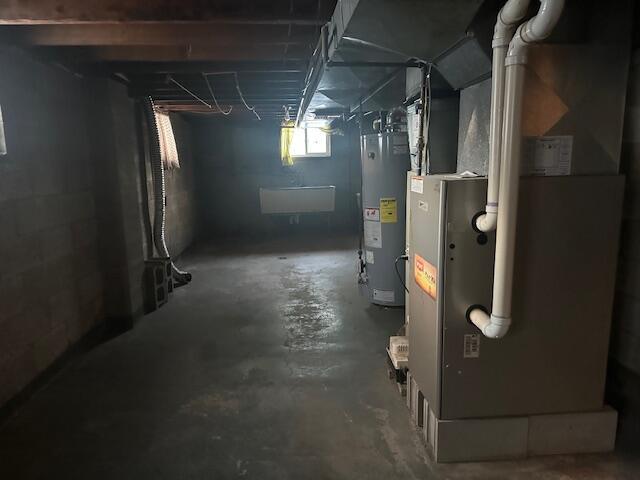 basement with heating unit and water heater