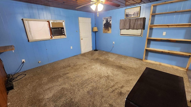 interior space featuring carpet flooring, wood ceiling, and wooden walls