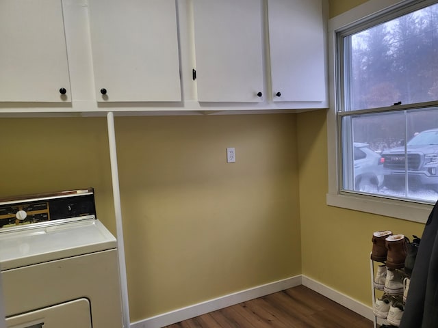 washroom featuring dark hardwood / wood-style flooring and washer / clothes dryer