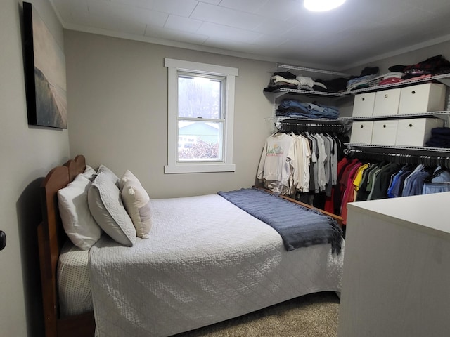 bedroom featuring carpet and ornamental molding