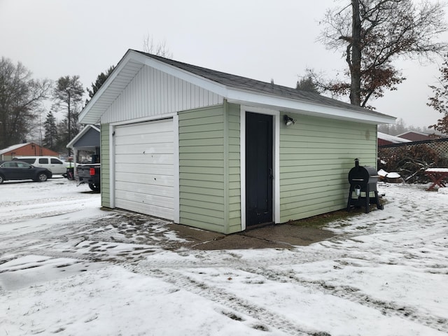 view of snow covered garage