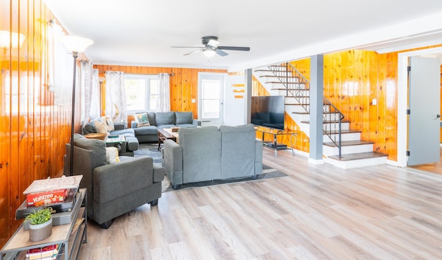 living room featuring ceiling fan and light wood-type flooring