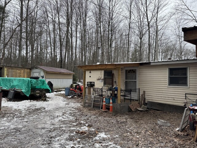 view of side of property featuring a carport