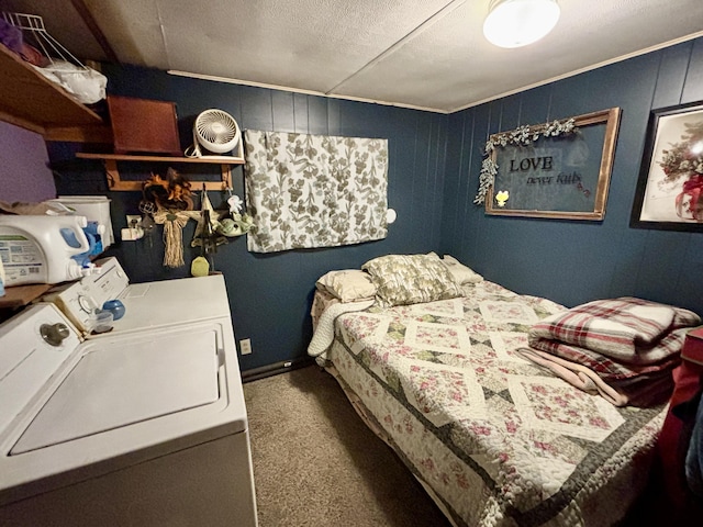 carpeted bedroom with washing machine and dryer