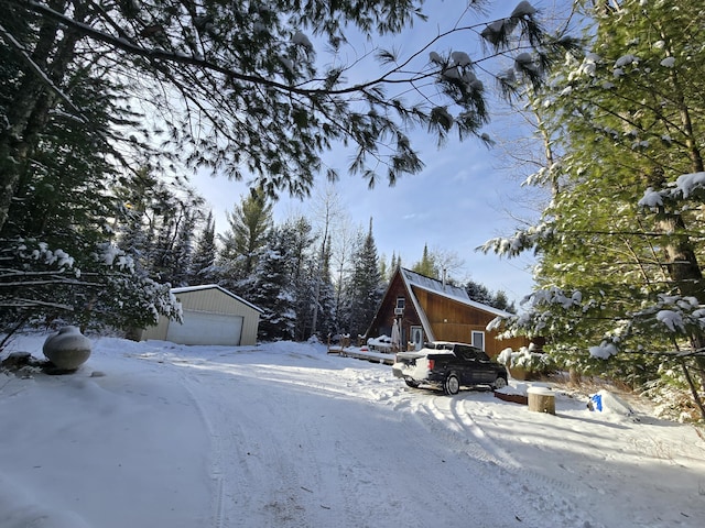 exterior space with a garage and an outdoor structure